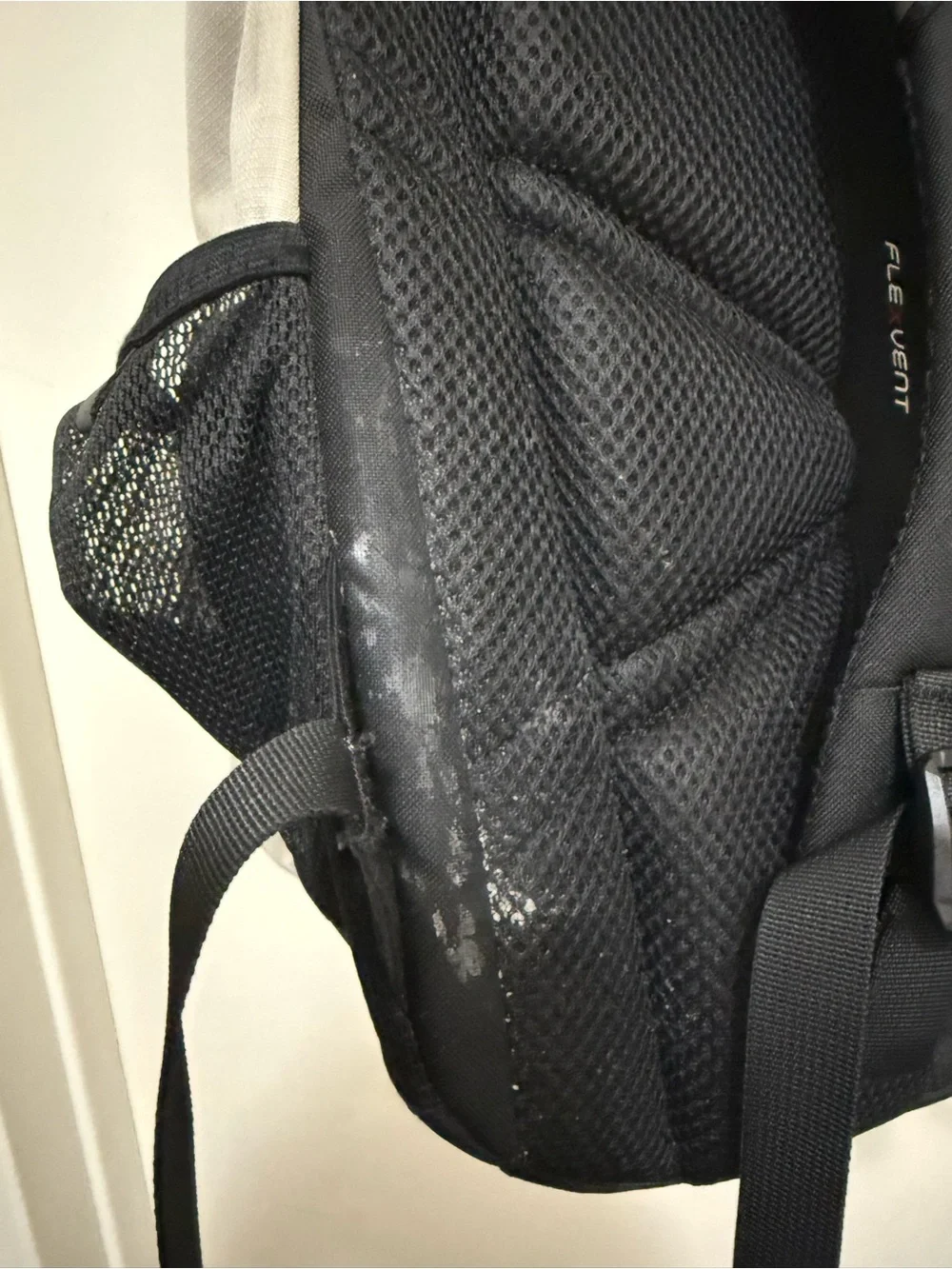 The North Face Two-Tone Beige and Black Backpack with Bungee Front